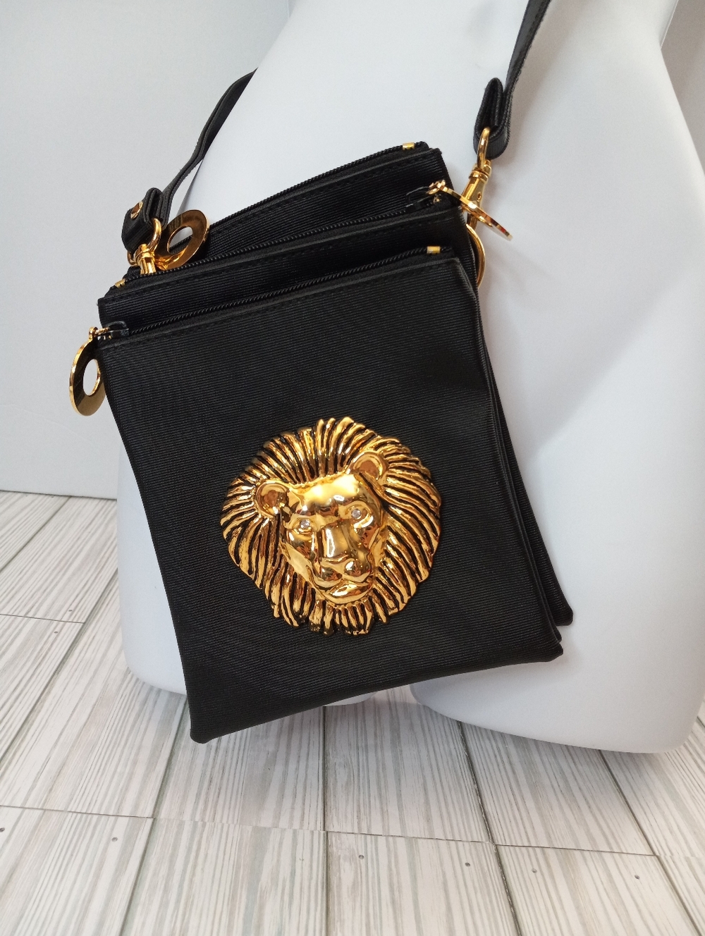 Nima Mini Black Crossbody Bag with Ornate Metal Gold Lion Medallion Accent